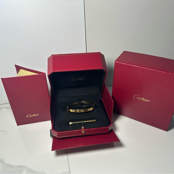 Cartier. Jewelry - Cartier Gold and Black Love Bracelet with Red Presentation Box
